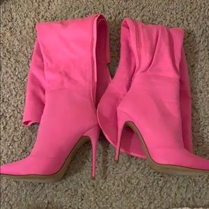 Bright pink knee high boots